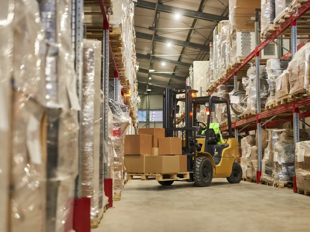 Forklift Lifting and Moving Inventory